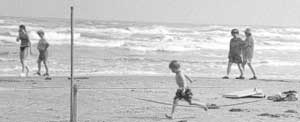 child running on the beach